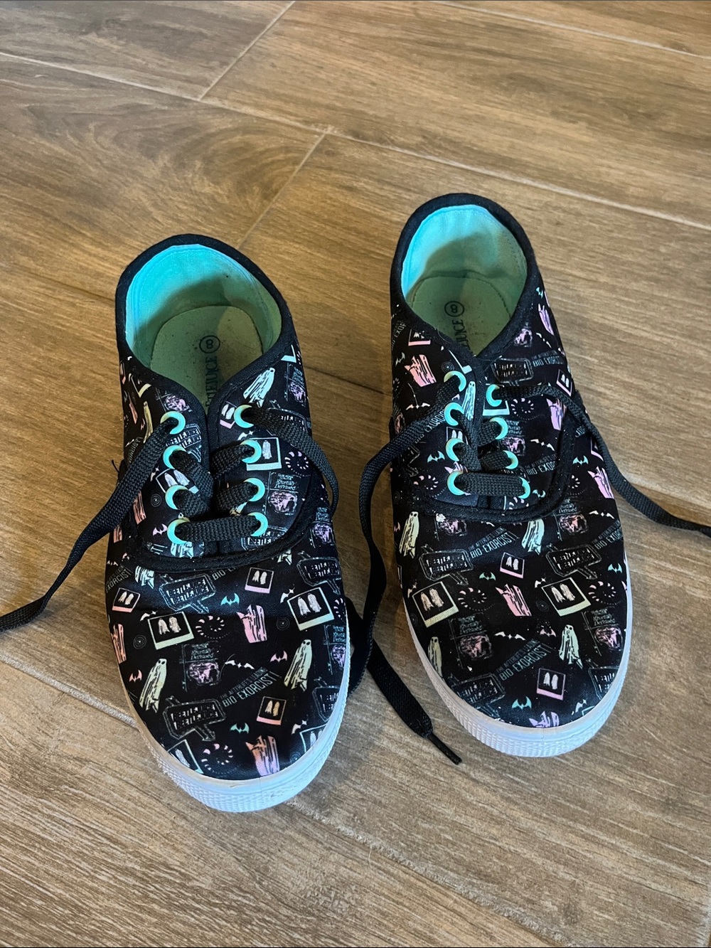 Girls Hot Topic Beetlejuice black Lace-Up Sneakers with Teal Interior.